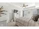 Cozy main bedroom featuring a tray ceiling, ceiling fan, and neutral décor, creating a relaxing retreat at 7254 Cambridge Pl, Avon, IN 46123