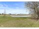 A serene pond is surrounded by a well-manicured lawn and residential homes at 7254 Cambridge Pl, Avon, IN 46123