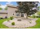 Brick patio with a fire pit sits off the back of this home at 7383 Poppyseed Dr, Indianapolis, IN 46237