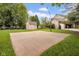 Backyard features a basketball court and a storage shed with well-maintained lawn at 7383 Poppyseed Dr, Indianapolis, IN 46237