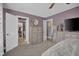 Spacious carpeted bedroom with walk-in closet, TV and dresser with neutral colors creates a calming atmosphere at 7383 Poppyseed Dr, Indianapolis, IN 46237