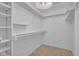 A well-organized walk-in closet with shelving and plenty of space at 7383 Poppyseed Dr, Indianapolis, IN 46237