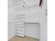 A well-organized walk-in closet with shelving and a chandelier at 7383 Poppyseed Dr, Indianapolis, IN 46237