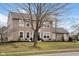 Traditional home with well-maintained lawn and landscaping, enhancing its curb appeal on a sunny day at 7383 Poppyseed Dr, Indianapolis, IN 46237