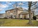 Two-story home featuring landscaped yard, classic siding, and a welcoming front entrance at 7383 Poppyseed Dr, Indianapolis, IN 46237