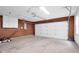 Spacious garage with ample room for parking and storage, equipped with a garage door opener at 7383 Poppyseed Dr, Indianapolis, IN 46237