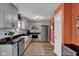 Well-lit kitchen with stainless steel appliances, grey cabinetry, and stylish countertops at 7383 Poppyseed Dr, Indianapolis, IN 46237