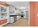 Bright eat-in kitchen featuring white cabinets, stainless steel appliances, and a large window, offering natural light at 7383 Poppyseed Dr, Indianapolis, IN 46237