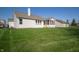 Spacious backyard featuring a well-manicured lawn and a view of the house at 7713 Imperial Eagle Dr, Zionsville, IN 46077