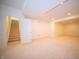 Unfinished basement with carpeted floors, recessed lighting, and a stairway at 7713 Imperial Eagle Dr, Zionsville, IN 46077