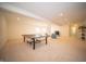 Spacious basement with recessed lighting, carpeted floors, and ping pong table at 7713 Imperial Eagle Dr, Zionsville, IN 46077