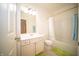 Well-lit bathroom featuring tiled floors, vanity with sink, and a bathtub with shower at 7713 Imperial Eagle Dr, Zionsville, IN 46077