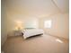 Well-lit bedroom with neutral carpet, a window, and a queen size bed at 7713 Imperial Eagle Dr, Zionsville, IN 46077