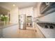 Functional kitchen with stainless steel appliances, light-colored cabinetry, and an island for extra prep space at 7713 Imperial Eagle Dr, Zionsville, IN 46077