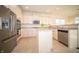 Bright kitchen featuring stainless steel appliances, a central island, light countertops and a stainless steel dishwasher at 7713 Imperial Eagle Dr, Zionsville, IN 46077