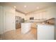 Well-lit kitchen with white cabinetry, stainless steel appliances, a center island, and tile flooring at 7713 Imperial Eagle Dr, Zionsville, IN 46077