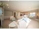 Open-concept living area featuring neutral tones, with access to a bright kitchen and a dining area at 7713 Imperial Eagle Dr, Zionsville, IN 46077