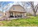 View of backyard with covered patio and furniture at 7845 Bluff Rd, Indianapolis, IN 46217