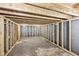 Unfinished basement with framed walls and concrete floors offers room for expansion and storage at 7845 Bluff Rd, Indianapolis, IN 46217