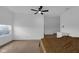 Spacious bedroom with ceiling fan, carpet, and an abundance of natural light at 7845 Bluff Rd, Indianapolis, IN 46217