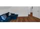 Comfortable bedroom space with wood flooring, plush seating, and a neutral palette at 7845 Bluff Rd, Indianapolis, IN 46217