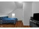 Bedroom with a modern bed, hardwood floors, and natural light at 7845 Bluff Rd, Indianapolis, IN 46217