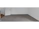 Bright bedroom features neutral carpet, fresh white trim and walls, and natural light at 7845 Bluff Rd, Indianapolis, IN 46217