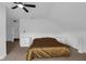 Bright bedroom features plush carpet, ceiling fan and comfortable furnishings at 7845 Bluff Rd, Indianapolis, IN 46217