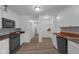 Modern kitchen with white cabinets and butcher block countertops at 7845 Bluff Rd, Indianapolis, IN 46217