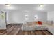 Bright living room showcasing hardwood floors, fresh white walls and natural light at 7845 Bluff Rd, Indianapolis, IN 46217