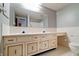 Bathroom featuring double vanity with cabinet space and tile flooring at 8151 Taunton Rd, Indianapolis, IN 46260