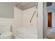 Bathroom with a tub and shower combo and tile surround at 8151 Taunton Rd, Indianapolis, IN 46260