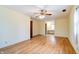 Spacious room featuring a ceiling fan and hardwood floors, bathed in natural light at 8151 Taunton Rd, Indianapolis, IN 46260