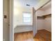 Bedroom with desk area, hardwood floors, closet and window with natural light at 8151 Taunton Rd, Indianapolis, IN 46260
