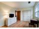 Bedroom featuring ample storage, hardwood floors and natural light at 8151 Taunton Rd, Indianapolis, IN 46260