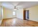Large bedroom with hardwood floors and ample natural light, offering comfort and style at 8151 Taunton Rd, Indianapolis, IN 46260