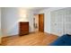 Bedroom featuring hardwood floors, closet, and a serene atmosphere, ideal for relaxation at 8151 Taunton Rd, Indianapolis, IN 46260