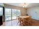 Dining area with sliding glass doors to deck offering great views and indoor/outdoor living at 8151 Taunton Rd, Indianapolis, IN 46260