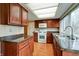 Traditional kitchen featuring wood cabinetry, granite countertops, and a well-lit, functional layout at 8151 Taunton Rd, Indianapolis, IN 46260