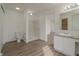 Bathroom with toilet, shower, vanity and sink with natural light and laminate wood flooring at 10309 Buckshire Ln, Indianapolis, IN 46234