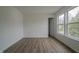 This bedroom has wood floors and a window providing natural light at 10309 Buckshire Ln, Indianapolis, IN 46234