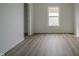 This bright bedroom features wood flooring and a window for natural light at 10309 Buckshire Ln, Indianapolis, IN 46234