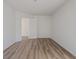 Empty room featuring new floors and fresh white walls, ready to be personalized for your needs at 10309 Buckshire Ln, Indianapolis, IN 46234