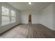 This bright, empty bedroom offers a walk-in closet and natural light at 10309 Buckshire Ln, Indianapolis, IN 46234