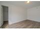 The bedroom features modern flooring, fresh paint, and closet storage at 10309 Buckshire Ln, Indianapolis, IN 46234