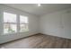 This room features new flooring, fresh paint, and a view of the community at 10309 Buckshire Ln, Indianapolis, IN 46234