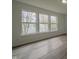 This bedroom boasts bright light, wood-look floors, and neutral walls at 10309 Buckshire Ln, Indianapolis, IN 46234