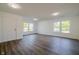 Spacious living room with hardwood floors, freshly painted walls, and an abundance of natural light at 10309 Buckshire Ln, Indianapolis, IN 46234