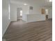 Bright living room with neutral walls, wood-look flooring, and open layout at 10309 Buckshire Ln, Indianapolis, IN 46234