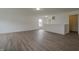 Bright living room with neutral walls, wood-look flooring, and natural light at 10309 Buckshire Ln, Indianapolis, IN 46234